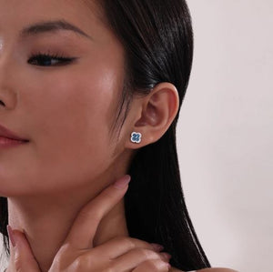 Blue Topaz 0.8 CTW Halo Stud Earrings