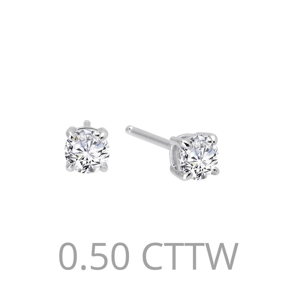 Each of these classy earrings features a frameless simulated diamond  dangled from a hoop in sterling silver bonded with platinum combined with  14-karat gold components - Diamond & Design